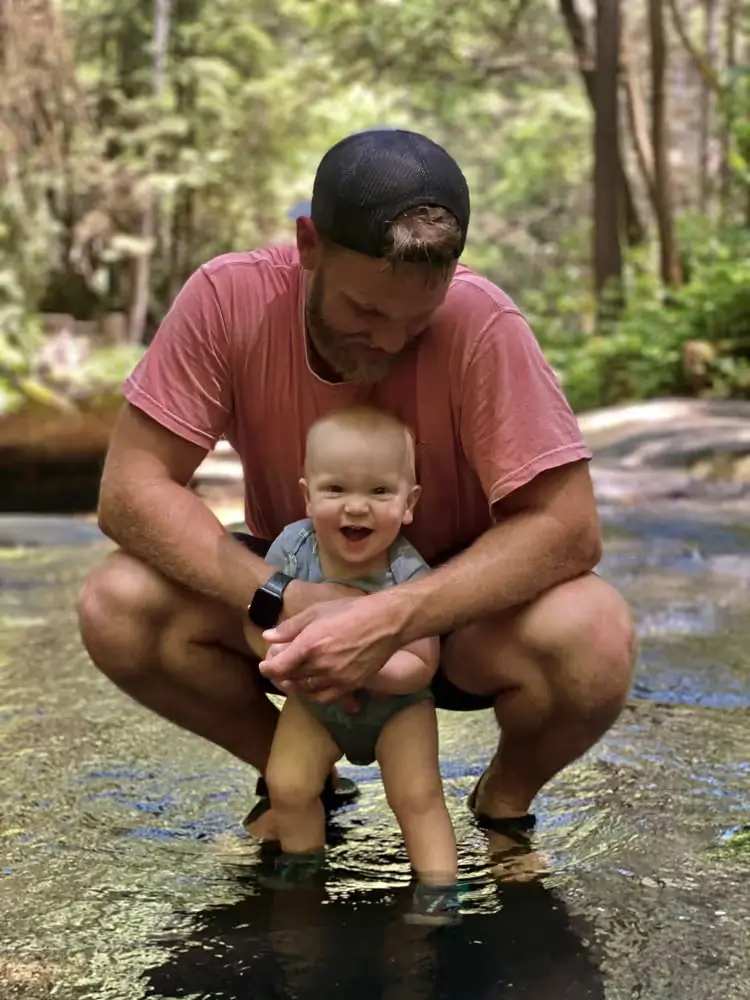 Dr. Friend and baby in nature